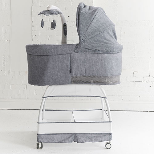 Large Storage Basket Sweetli Baby Bassinet Sleeper on Wheels for Boys or Girls with Crib Mobile Removable Canopy and 2 Sheets Stonewash Gray 